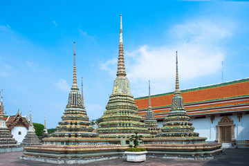 Bangkok, Thailand - Three ground-level spires featured prominently within a Buddhist temple.