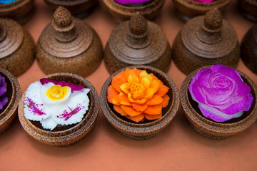 Obraz na płótnie Canvas Thailand, Samui Island, Ko Samui. Traditional handicrafts, intricately carved soap to look like tropical flowers.