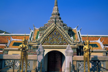 Fototapeta na wymiar Asia, Thailand, Bangkok. Wat Phra Kaeo, Kinnarees and temple gate.