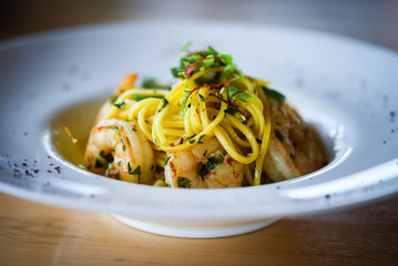 fresh italian pasta with garlic, pepperoni, olive oil & grilled shrimps