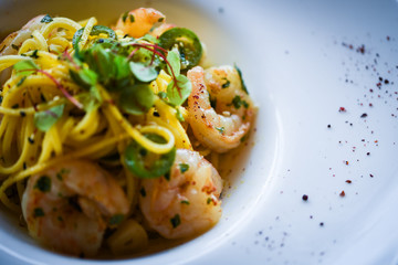 fresh italian pasta with garlic, pepperoni, olive oil & grilled shrimps