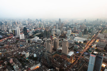Bangkok, Thailand - The downtown district of a city with smog in the background.