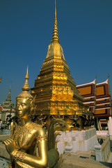 Fototapeta premium Thailand, Bangkok. Gold statues at Wat Phra Kaew Temple.