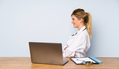 Blonde doctor woman in lateral position