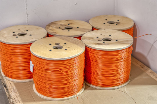 Coils with detonation cord. Multi-colored wire of orange and yellow.