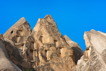 Houses carved into the rock formations in the valley, Goreme, Cappadocia, Turkey (UNESCO World Heritage Site)