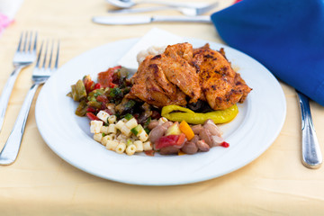 Plate of food for dinner at the hotel. Diet for dinner fried chicken, vegetables, stews, pasta, peppers, beans