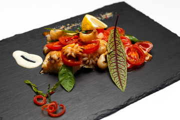 salad of raps and octopus with greens and creamy sauce