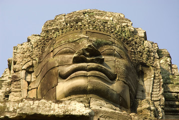 Cambodia. Siem Reap. Angkor Thom. Carved face on the upper level of Bayon Temple.