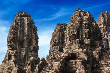 Fototapeta na wymiar Siem Reap, Cambodia. Ancient ruins and towers of the Bayon Temple in Angkor Thom