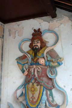 Asia, Vietnam. Painted figurine on the wall of the Thien Mu Pagoda, Hue, Thua Thien&ndash;Hue