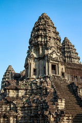 Naklejka premium Siem Reap, Cambodia. Ancient ruins and towers of the Bayon Temple Angkor Wat