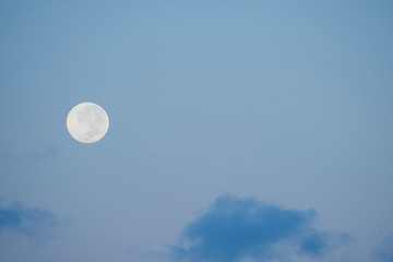 Australia, Northern Territory, Darwin. Full moon, moonrise with blue sky.