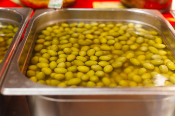 sale of marinated olives on the market