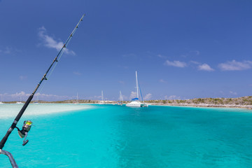 Bahamas, Exuma Island, Cays Land and Sea Park. Moored sailboats and fishing rod. Credit as: Don Paulson / Jaynes Gallery / DanitaDelimont.com