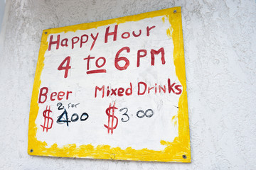 British Virgin Islands, Sandy Cay, Tortola. Happy Hour sign, Cane Garden Bay