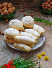 Traditional Azerbaijan holiday Novruz cookies and sweeties on white plate on the rustic background with nuts and hazelnuts and samani,flat lay,space for text