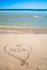 Vieques, Puerto Rico - A heart is drawn in the sand of a beach with the word 'amor' inside.