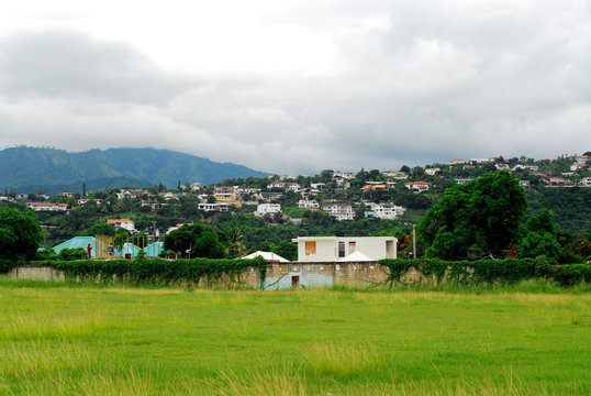 Jamaica, Kingston, view of mountain range covered with foggy sky by built structure on mountain in the foreground