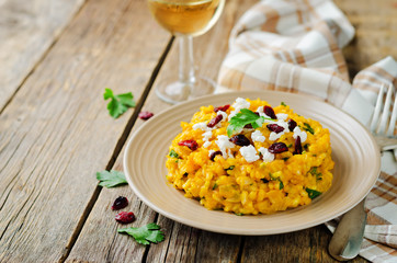 Pumpkin risotto with dried cranberries and goat cheese