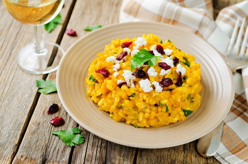 Pumpkin risotto with dried cranberries and goat cheese