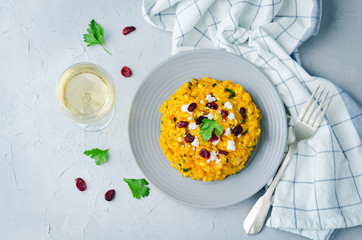 Pumpkin risotto with dried cranberries and goat cheese