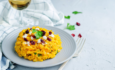 Pumpkin risotto with dried cranberries and goat cheese
