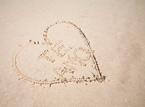 Vieques, Puerto Rico - A heart is drawn in the sand of a beach with the words 'te amo' inside.