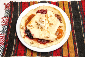traditional pancakes with 6 different  jams