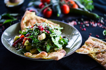 fresh quinoa salad with mix of vegetables & focaccia bread