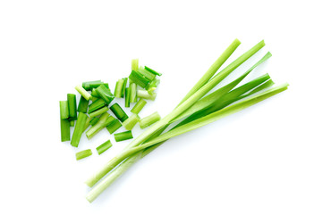 Fresh healthy organic green vegetable garlic chives, chinese chive sliced, green herb isolated on white background. - obrazy, fototapety, plakaty