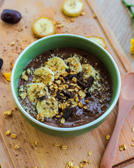 Chocolate banana smoothie with granola