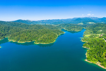 Croatia, Gorski kotar, beautiful Lokvarsko lake, green forest and Risnjak mountain landscape