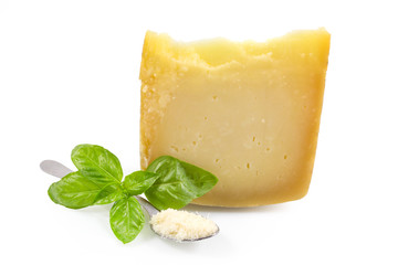 piece of cheese or Italian cheese with fresh green basil isolated on white background with clipping path.
