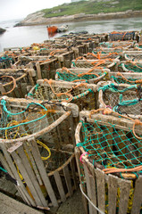 Canada, Nova Scotia, Peggy's Cove. Lobster traps on typical dock.