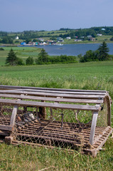 Canada, Prince Edward Island. Hostetter's Overlook, view of typical fishing village, lobster trap.