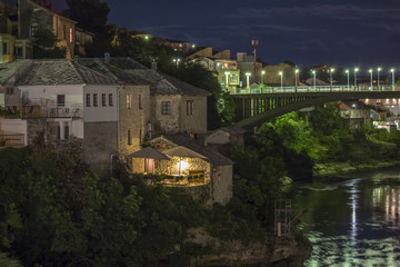 Fototapeta na wymiar Mostar, Bosnia and Herzegovina at night . The Old Bridge, Stari Most, with emerald river Neretva.