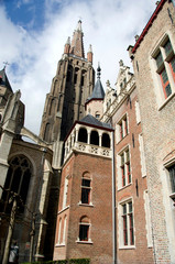 Fototapeta premium Belgium, Brugge (aka Brug or Bruge). Historic Brugge, UNESCO World Heritige Site.Courtyard views of the Church of Our Lady.