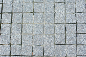 Old paving slabs, texture paving stone track, closeup, top view