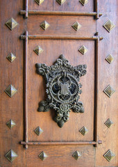 Czech Republic, Hluboka Castle. An intricate shield adorns the main door to the entrance of Hluboka Castle, South Bohemia, Czech Republic.