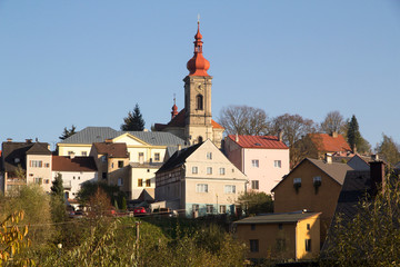 Czech Republic, Ustecky Region, Becov. St. Jiri (George) church clock tower and village.