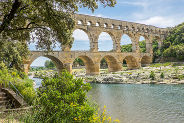 Fototapeta na wymiar France, Nimes, the Pont du Gard is an ancient Roman aqueduct bridge that crosses the Gardon River. It is made of limestone between 40-60 AD.