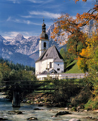 Germany, Bavaria, Ramsau. The Ramsauer Ache flows by the church, or Kunterwegkirche, at Ramsau in Bavaria, Germany.