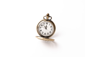 Old pocket watch closeup isolated on white background