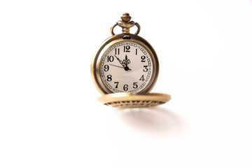 Old pocket watch closeup isolated on white background