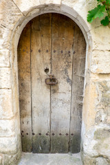 France, Provence, Luberon, Menerbes. Wooden door to vacated home.