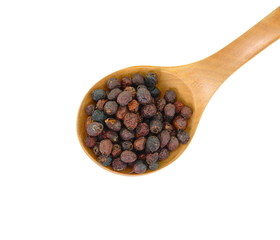 Dried medicinal herbs raw materials isolated on white. Fruit of Crataegus commonly called hawthorn, thornapple, May-tree, whitethorn, or hawberry. Cure for the heart.