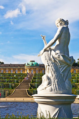 Germany, Brandenburg, Preussen, Potsdam. Statue of the Greek goddess Juno with a peacock next to...