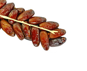 Dried dates over white background. Heap of dried dates isolated on white background.