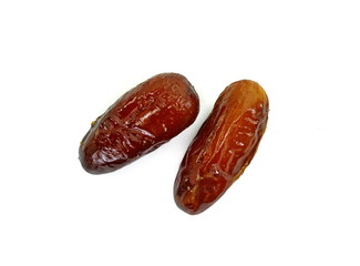 Dried dates over white background. Heap of dried dates isolated on white background.